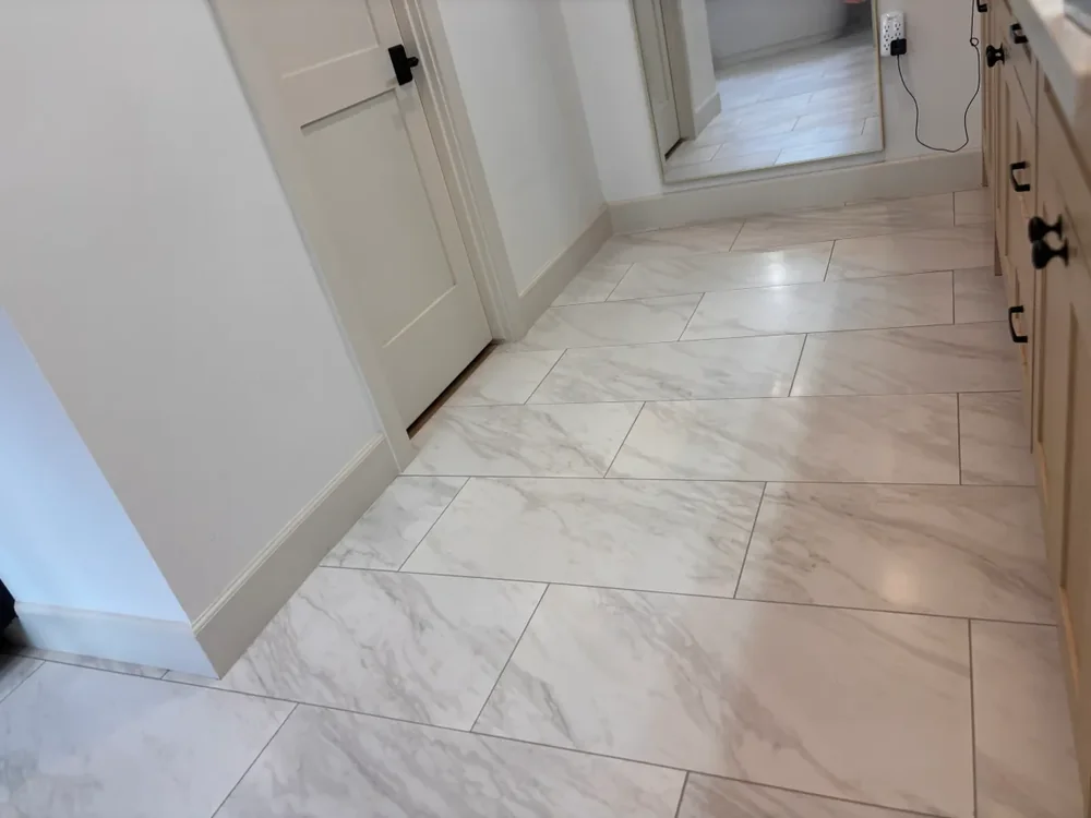 Marble-look tile floor with clean uniform grout lines